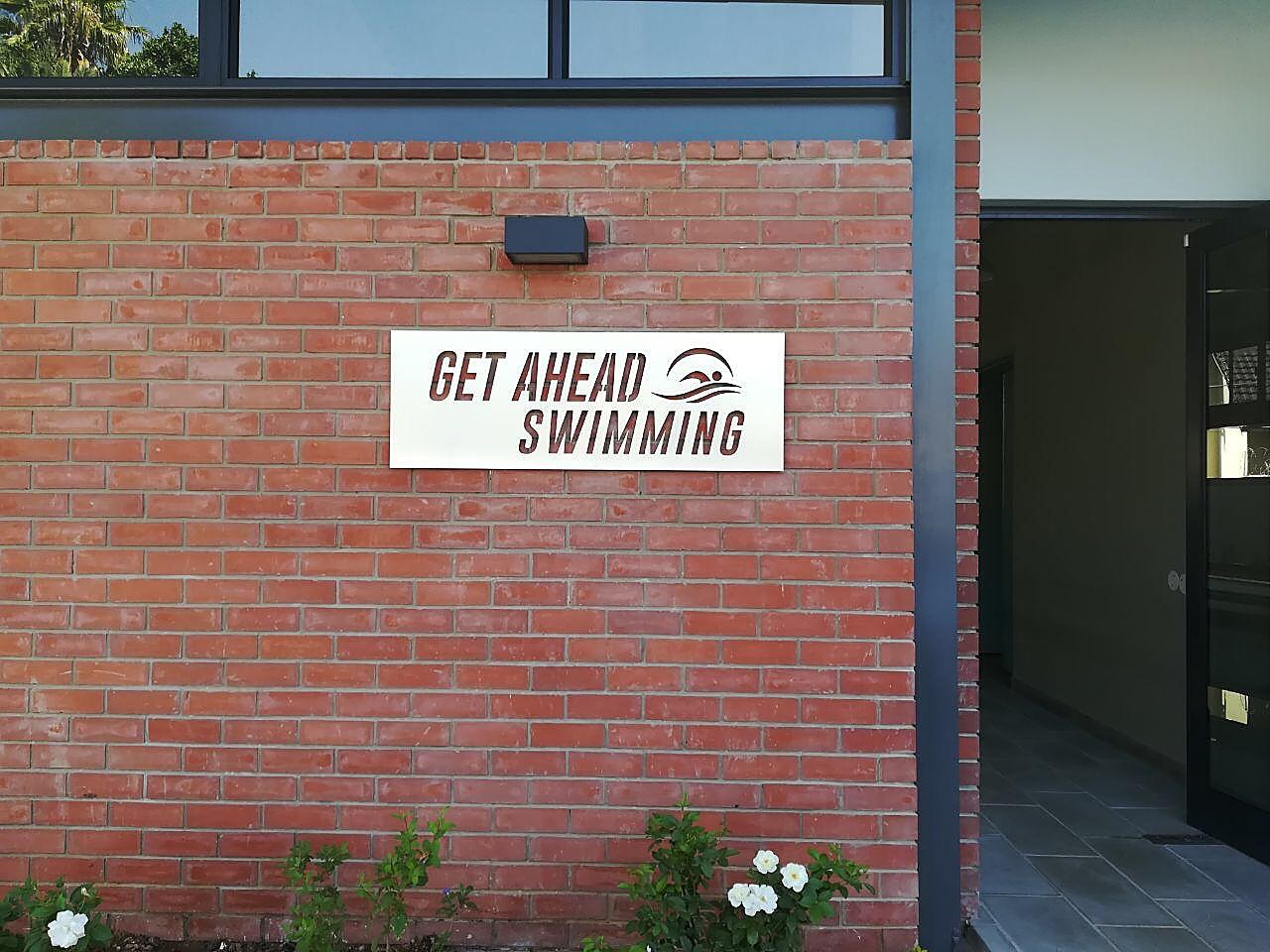 Get Ahead Swimming sign at the entrance of the Fairvale facility