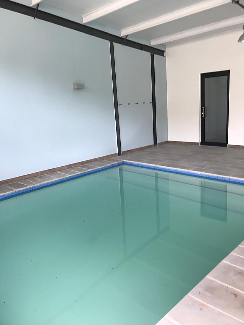 Indoor pool area with a pool slide